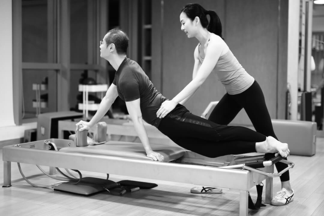 The Difference Between a Pilates Reformer Class and a Traditional Pilates  Class